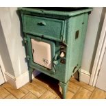 A 1940's Revo R8 enamelled electric cooker, metal plate displays 18727765, 230v, 5.