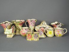 A quantity of Art Deco, Arthur Wood, ceramics with floral decoration and silvered rims,