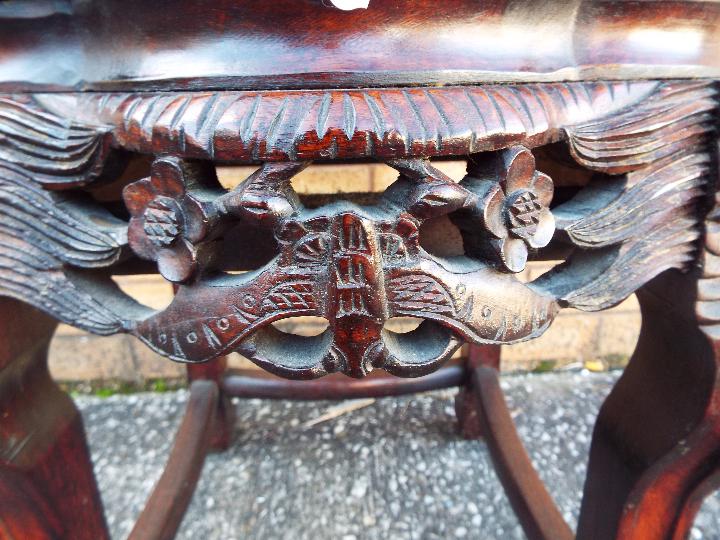 A Chinese, hardwood jardiniere stand with carved detailing and inset marble top, - Image 2 of 4