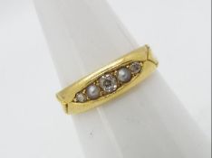 A late Victorian 18ct gold ring set with diamonds and seed pearls, size N, approximately 3.