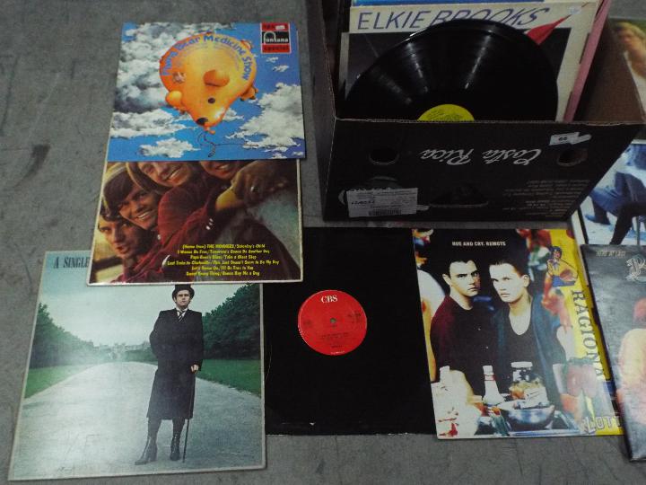 A large box of 12" vinyl records to include Berlin, Hue And Cry, Tina Turner, The Bee Gees, , - Image 2 of 4