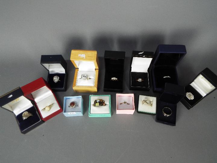 LOT WITHDRAWN - A collection of costume jewellery dress rings, all boxed.