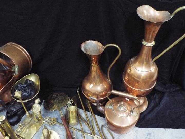 A large collection of copper and brass ware to include teapot, ewers / jugs, ornaments and similar, - Image 5 of 5