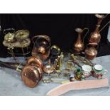 A large collection of copper and brass ware to include teapot, ewers / jugs, ornaments and similar,