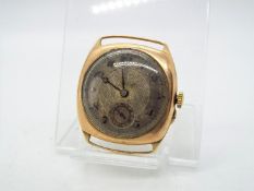 A 9ct gold cased wristwatch (lacking strap), approximately 22 grams all in.