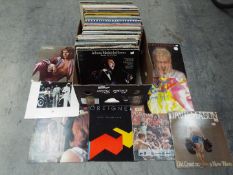 In excess of 100 12" vinyl records to include Cat Stevens, Sad Cafe, Hot Chocolate, Thompson Twins,