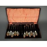 A cased set of George V hallmarked silver coffee spoons and sugar tongs (one spoon lacking),
