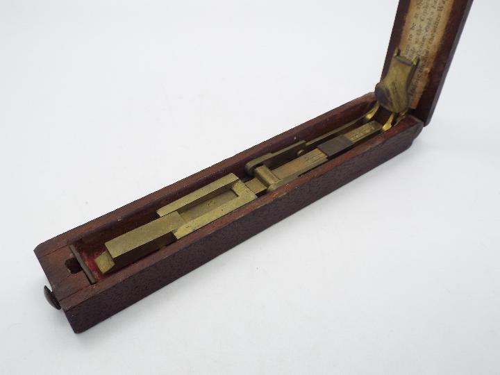 A folding brass guinea balance in mahogany case. - Image 2 of 4