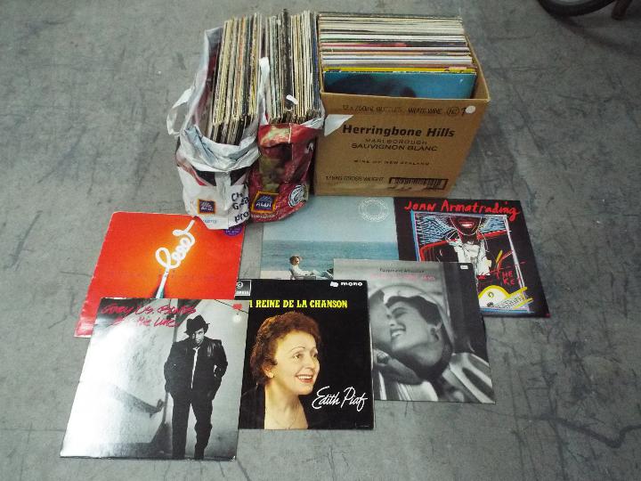 A quantity of 12" vinyl records to include Fairground Attraction, Joan Armatrading,