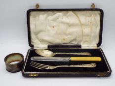 George V hallmarked silver spoon and fork (knife is stainless) contained in fitted case,