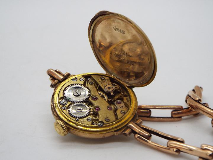 A lady's 9ct gold cased wristwatch on expanding bracelet marked Britannic 9ct (bracelet A/F), - Image 5 of 5