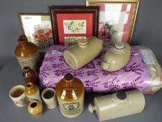 A collection of stoneware bottles and similar, framed watercolour, further pictures and curtains.