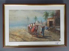 A watercolour desert scene, signed lower right by the artist, mounted and framed under glass,