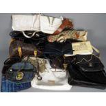 A quantity of lady's handbags and similar.
