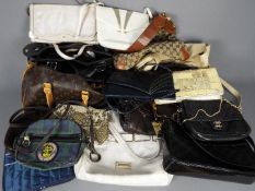 A quantity of lady's handbags and similar.