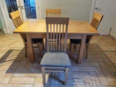 A Oakland furniture extending dining table with four matching chairs with grey upholstered seats,