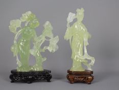 A Chinese, celadon green, bowenite carving of a lady in flowing robes holding a fan,