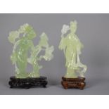 A Chinese, celadon green, bowenite carving of a lady in flowing robes holding a fan,