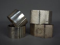 Four hallmarked silver napkin rings,