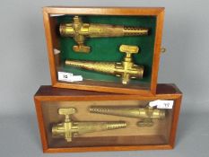 Breweriana - Four brass brewers taps, Veribest by Harry Mason, Birmingham, mounted in display cases.