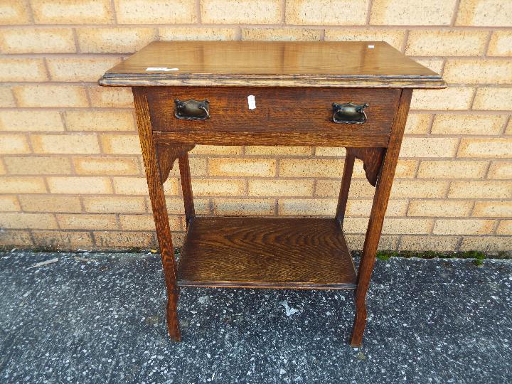 A small oak side table measuring approximately 75 cm x 61 cm x 37 cm