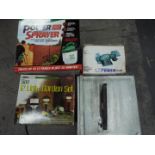 A collection of tools to include a tile cutter, boxed bench grinder,