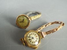 A 9ct gold cased wristwatch on expanding bracelet and a rolled gold wrist watch and strap.