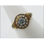 A 15ct gold ring set with seed pearls and black enamel, size N½, approximately 2.6 grams all in.