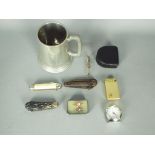 A mixed lot of collectables to include pen knives, vintage cigarette lighter,