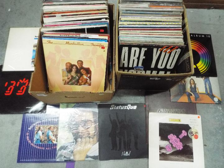 Two boxes of 12" vinyl records to include Level 42, The Police, Status Quo, Elton John, Rod Stewart,