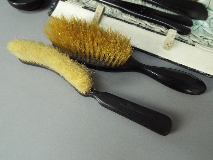 A lady’s vintage cased travel set containing Ebony dressing table items comprising a bevel edged - Image 3 of 5