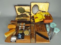 A collection of vintage, travelling grooming sets, dressing table set, powder compacts and similar.