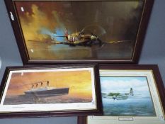 Three framed prints comprising a large print after Barrie A F Clark depicting a Spitfire in flight,