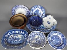 A collection of ceramics, predominantly blue and white, to include meat plates,