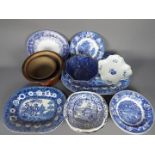 A collection of ceramics, predominantly blue and white, to include meat plates,