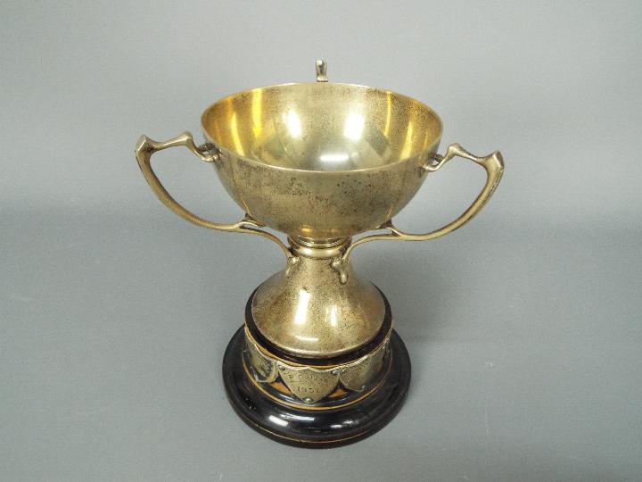 A George V hallmarked silver, Art Nouveau style, triple handled trophy, Sheffield assay 1933, - Image 2 of 6