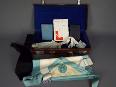 A Masonic regalia case with contents.