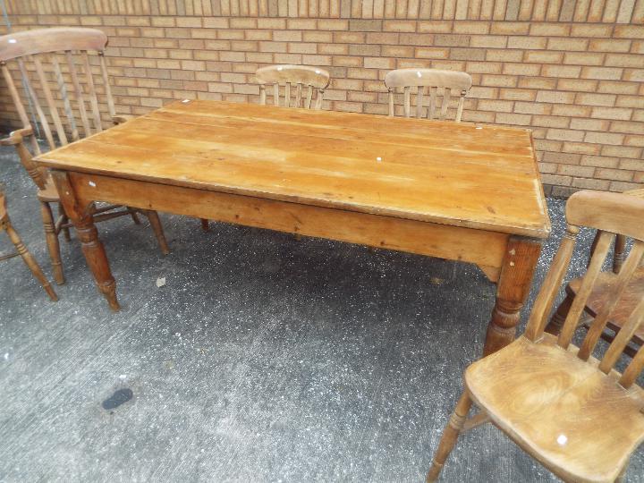 A pine dining table measuring approximately 73 cm x 172 cm x 99 cm with four chairs and two carvers. - Image 2 of 4