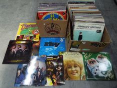 Two boxes of 12" vinyl records to include Dolly Parton, Dr Hook, Whitesnake, 10cc,