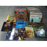 Two boxes of 12" vinyl records to include Dolly Parton, Dr Hook, Whitesnake, 10cc,