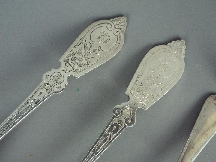 A Victorian spoon and fork with engraved decoration, Sheffield assay 1869/1870, - Image 2 of 3
