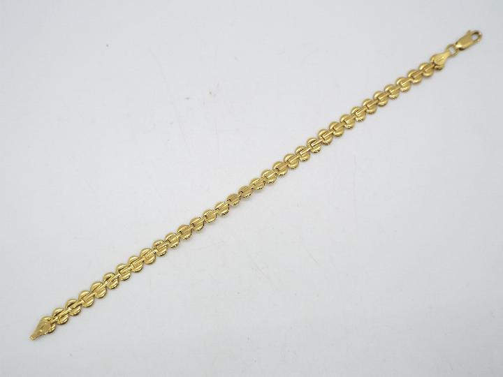 A high purity yellow metal bracelet, stamped 750 for 18ct, 19 cm length, approximately 6.