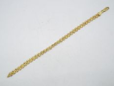 A high purity yellow metal bracelet, stamped 750 for 18ct, 19 cm length, approximately 6.