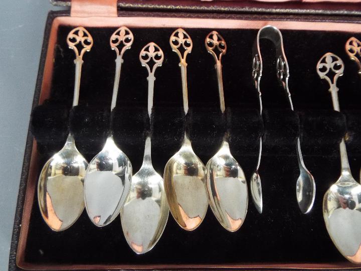 A cased set of George V hallmarked silver coffee spoons and sugar tongs (one spoon lacking), - Image 2 of 6