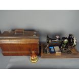 A wood cased Vibra sewing machine, a small Bells whisky decanter and contents, 18.