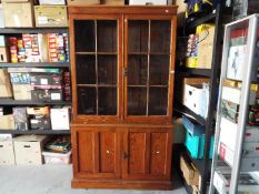 A pine library bookcase, approximately 197 cm x 114 cm x 43 cm.