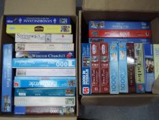 A large quantity of jigsaw puzzles, two boxes.