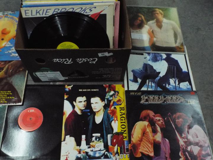 A large box of 12" vinyl records to include Berlin, Hue And Cry, Tina Turner, The Bee Gees, , - Image 3 of 4