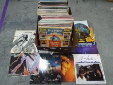 A large box of 12" vinyl records to include The beach Boys, Howard Jones, a-ha, Meat Loaf,