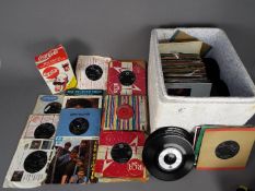 A quantity of 7" vinyl records to include The Beatles, Michael Jackson, The Monkees, The Animals,